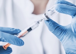 Scientist Filling a Needle